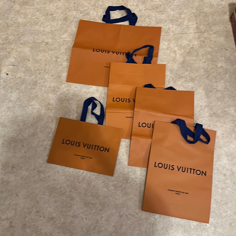 Assorted Louis Vuitton shopping bags